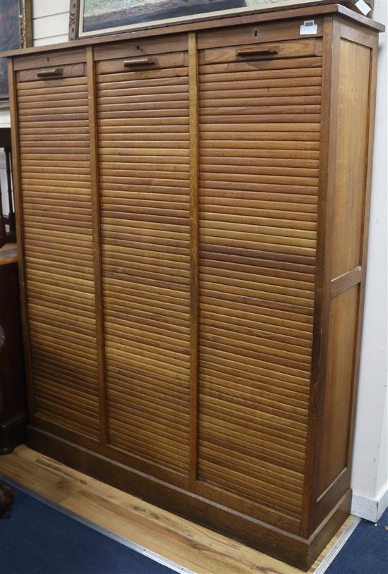 A French oak triple tambour fronted office cabinet, circa 1910 W.146cm, H.178cm